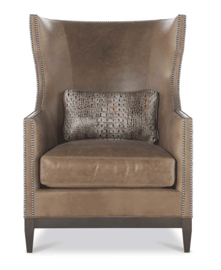 A sophisticated wingback armchair, upholstered in a rich, light brown leather. It features distinct… — 3D model
