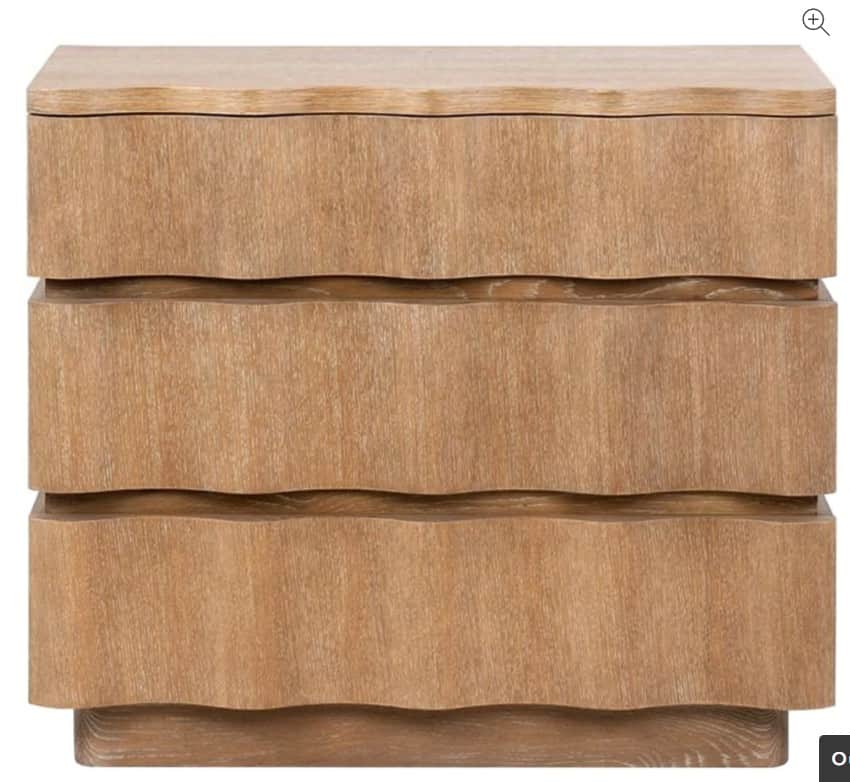 A compact, light-colored wooden nightstand featuring three drawers with distinct wavy fronts, restin… — 3D model