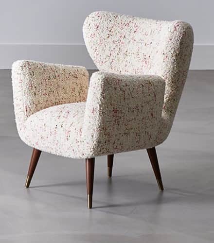 A vintage armchair with a high, wingback-style back and integrated arms. The upholstery has a textur… — free OBJ 3D model