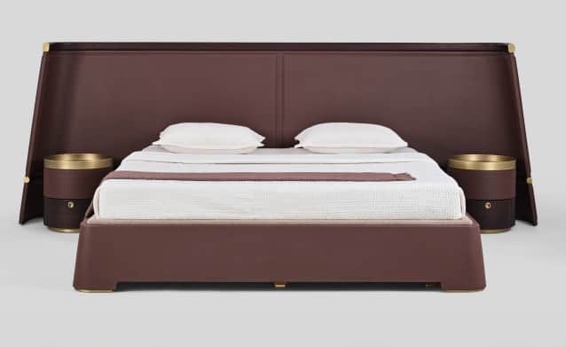 A contemporary upholstered platform bed featuring a broad, angled headboard that extends to either s… — free GLTF 3D model