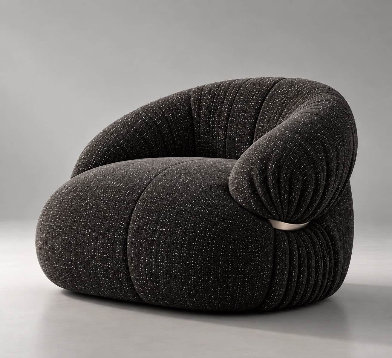 A contemporary, generously padded armchair with a sculptural and organic form, upholstered in a dark… — 3D model