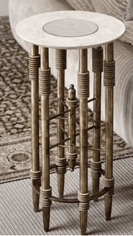 A tall, elegant pedestal table featuring a round white marble top with a subtle inset, supported by… — 3D model