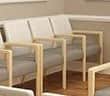 A modern armchair with a light wood frame and grey upholstered seat and backrest. The armchair featu… — free OBJ 3D model