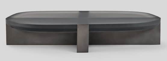 A contemporary coffee table featuring an oblong, dark translucent (smoked glass or acrylic) top with… — free OBJ 3D model