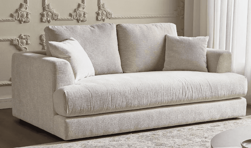 A contemporary deep-seated loveseat upholstered in a light-colored, textured woven fabric, featuring… — 3D model