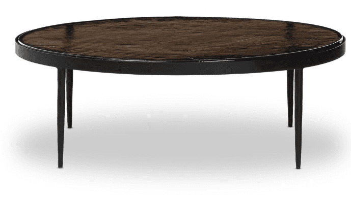 An oval coffee table with a dark, textured top and a thin black frame. It is supported by four slend… — free SKP 3D model