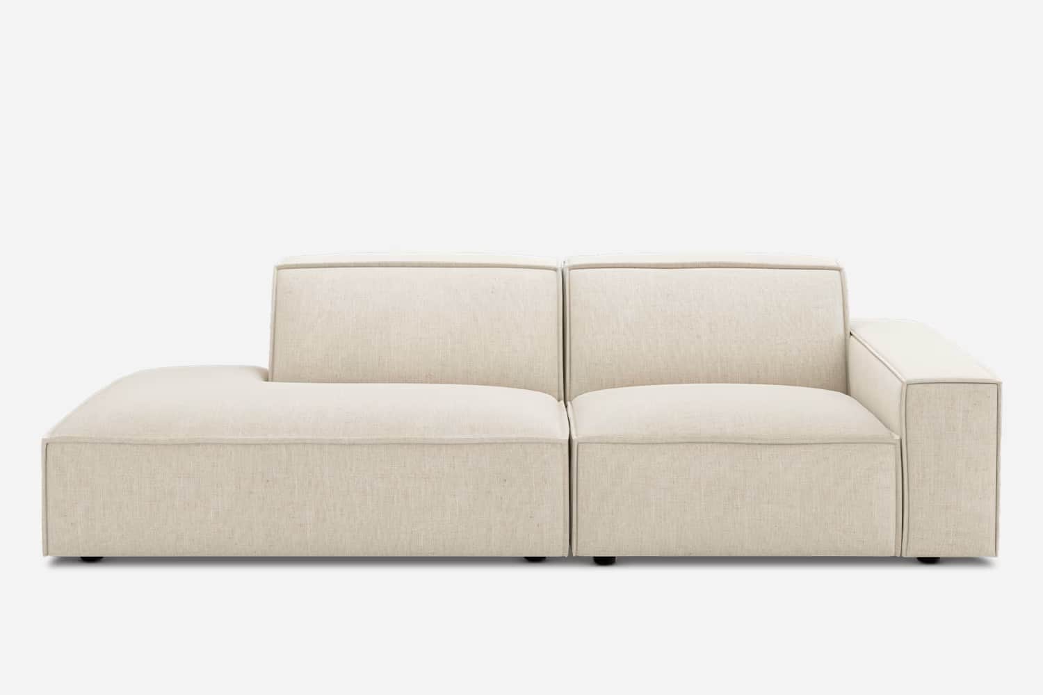 A modern, modular sectional sofa featuring an integrated chaise lounge, upholstered in a light, neut… — 3D model