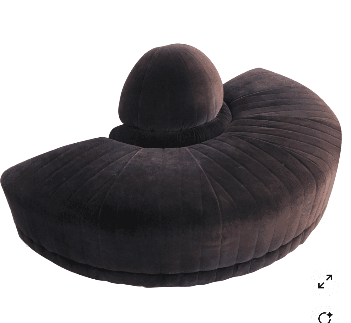 A contemporary, curved sofa upholstered in a dark grey or charcoal velvet fabric, featuring prominen… — 3D model