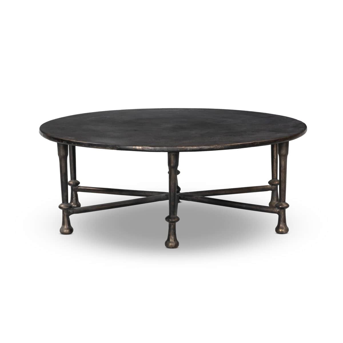 A round coffee table with a dark, textured top and a base constructed from four metal legs connected… — 3D model