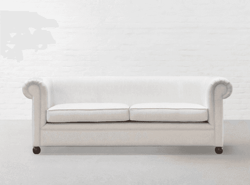 A cream-colored, two-seater loveseat featuring a traditional design with gracefully rolled arms and… — 3D model