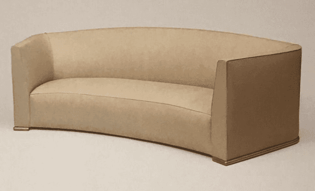 A curved, armless sofa with a tailored upholstery. The sofa features a subtle arc in its backrest an… — 3D model