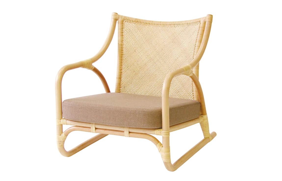 A low-slung lounge chair constructed from bent rattan with a woven cane backrest and a removable fab… — 3D model