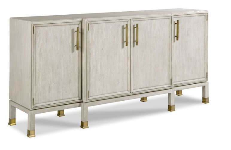 A long, low cabinet with four doors, raised on slender legs. The doors have a textured surface and a… — 3D model