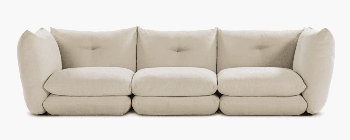 A three-seat sofa with a modular appearance, featuring deep, plush cushions and rounded arms. The ba… — 3D model