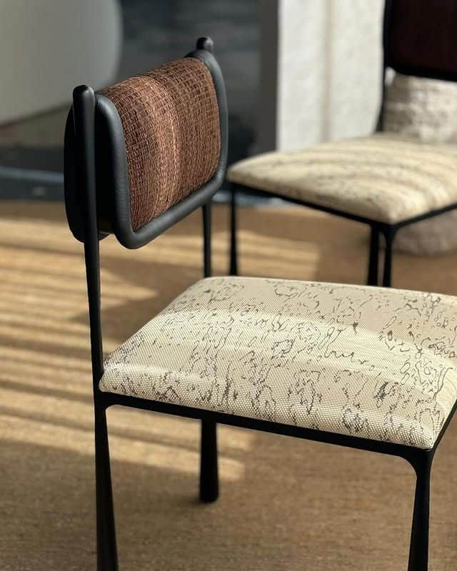 A modern side chair with a metal frame, upholstered seat, and upholstered backrest. The frame is bla… — 3D model