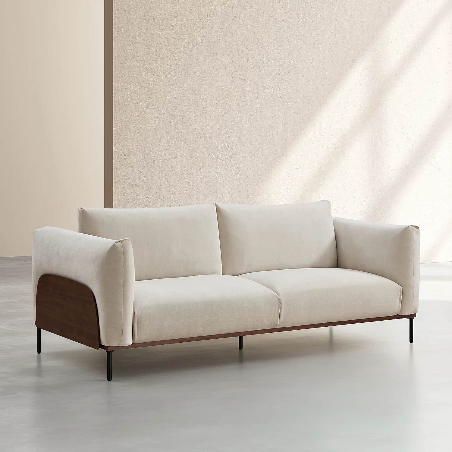 A two-seater sofa featuring a light beige fabric upholstery, dark wood armrest panels, and slender b… — 3D model