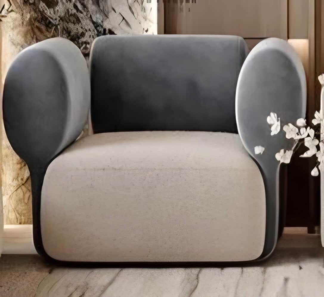 A modern armchair characterized by its soft, rounded, and sculptural form, featuring two-tone uphols… — free OBJ 3D model
