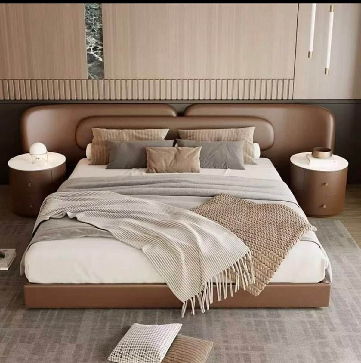 A modern platform bed featuring a wide, upholstered headboard with rounded edges, designed with a du… — 3D model