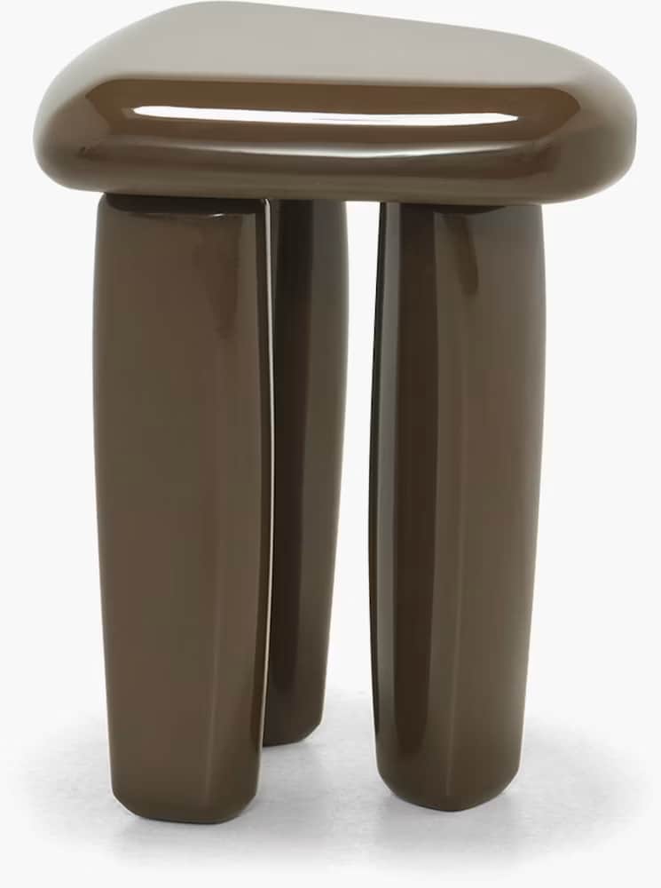 A contemporary, sculptural stool featuring a rounded triangular top and three thick, cylindrical leg… — 3D model