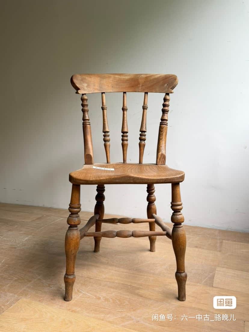 A vintage wooden side chair featuring a spindle back, turned legs, and a saddle-shaped seat, showcas… — 3D model