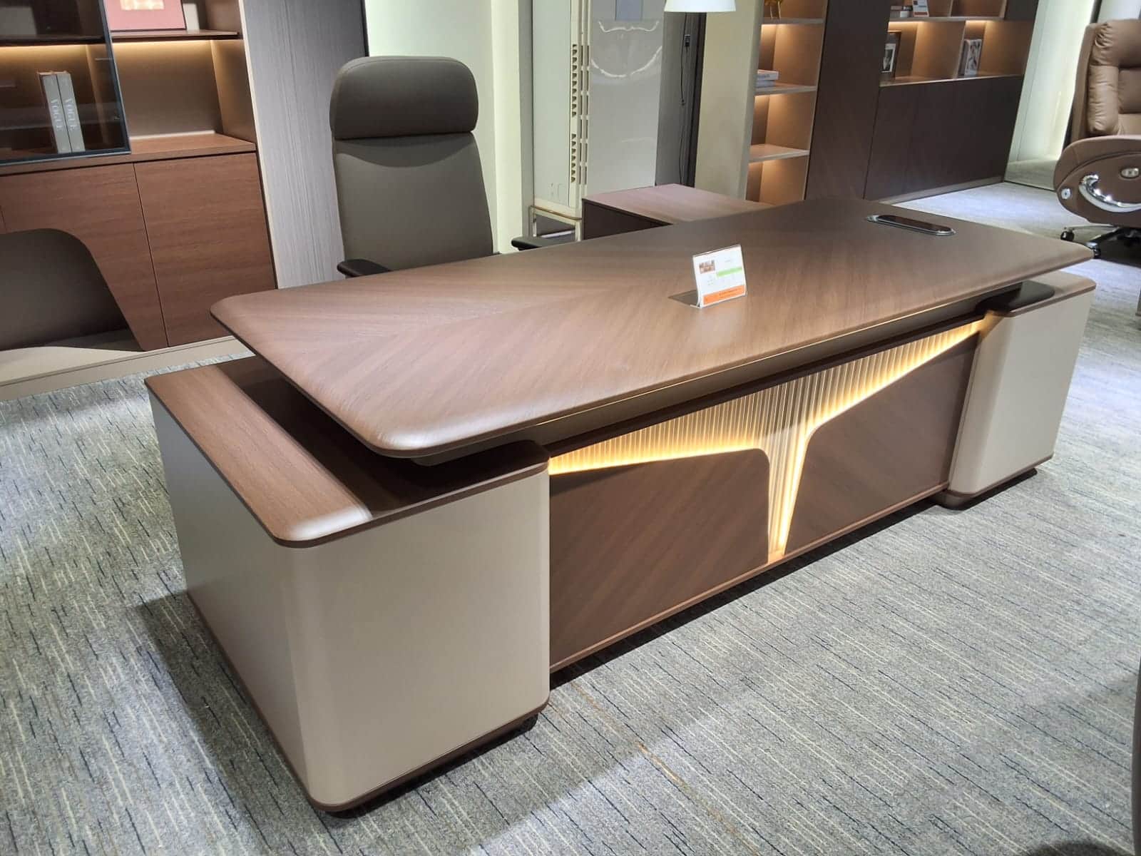 An executive desk featuring a layered, modern design with a dominant wood veneer surface, possibly w… — 3D model