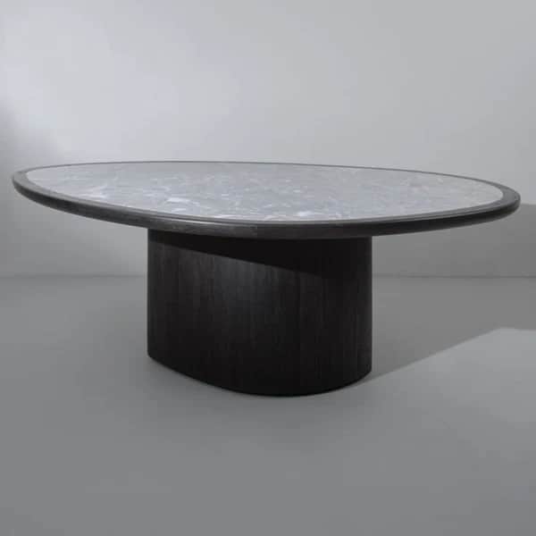 A contemporary coffee table featuring an irregular, organic-shaped light marble top supported by a s… — 3D model