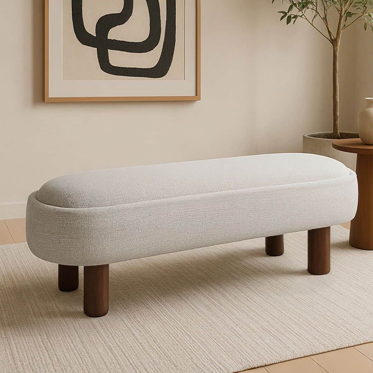 A modern upholstered bench featuring an elongated oval form factor, covered in a light-colored, text… — 3D model