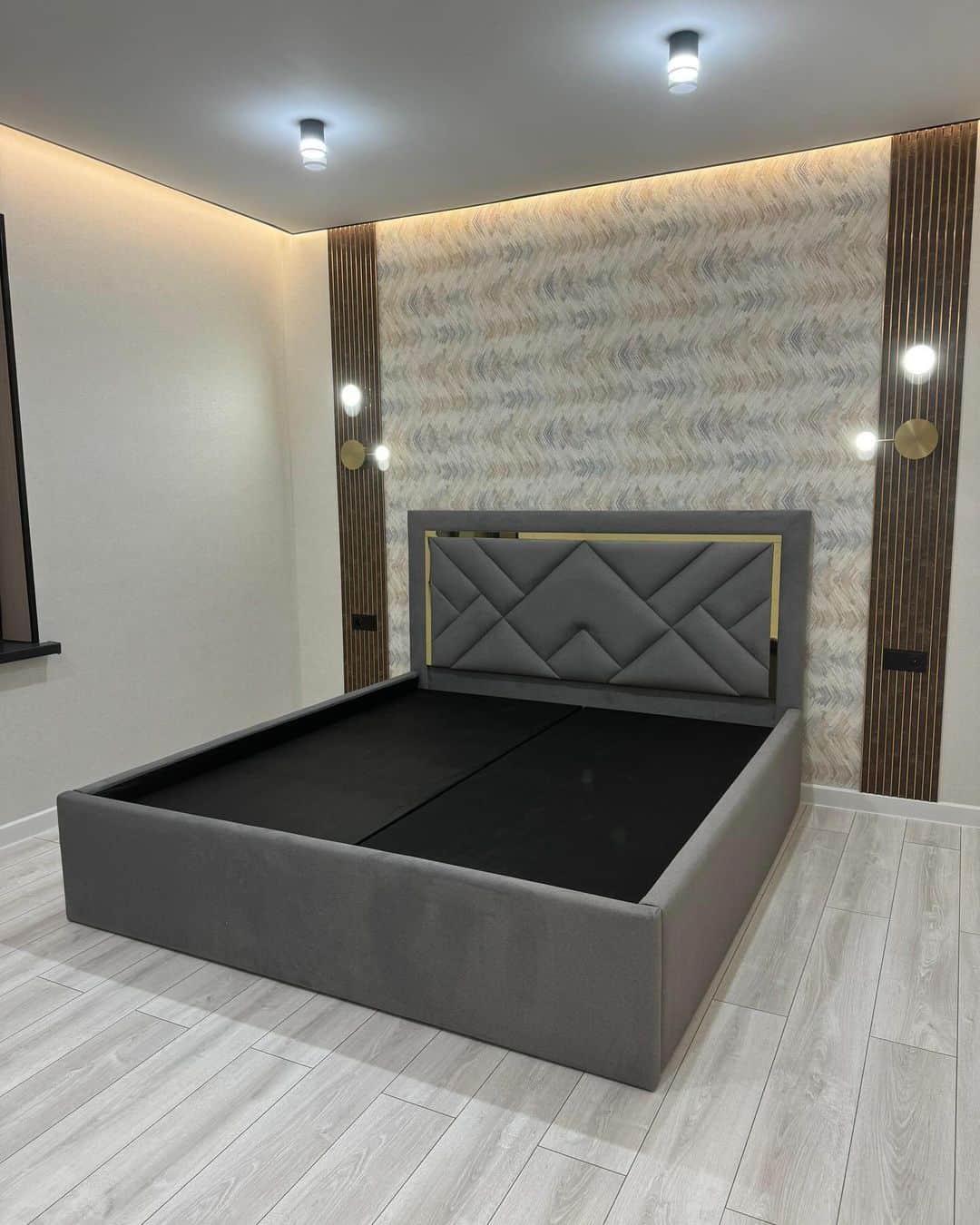 A contemporary platform bed frame featuring full gray fabric upholstery. The prominent headboard sho… — 3D model