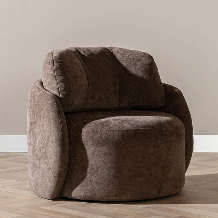 A contemporary upholstered lounge chair featuring a plush, rounded barrel silhouette in a taupe-brow… — 3D model