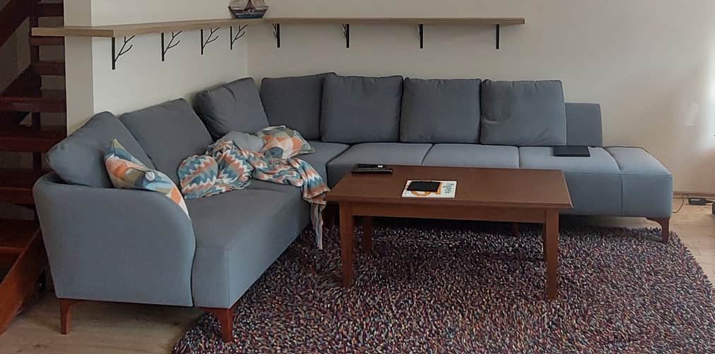 A sectional sofa with a chaise lounge extension. The sofa features a modular design with separate se… — 3D model