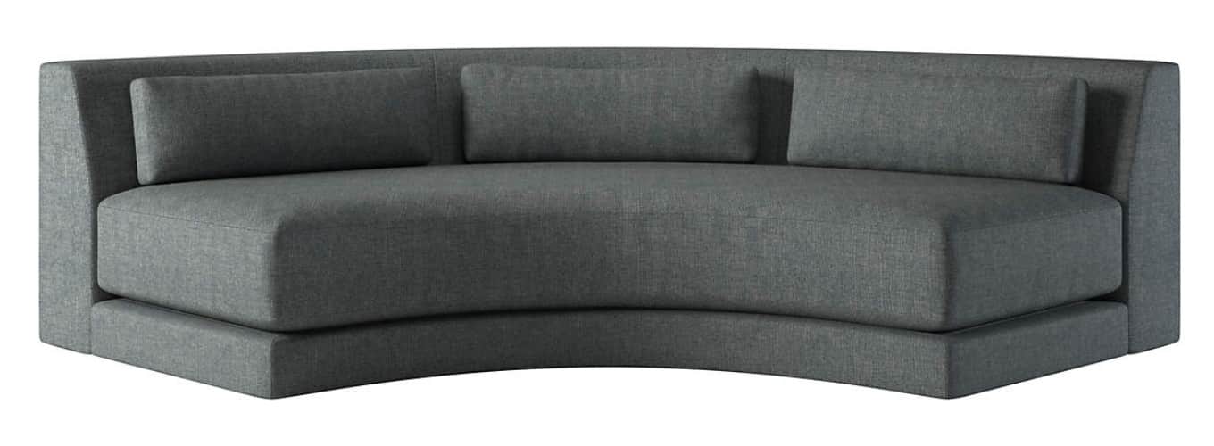A modern, curved sofa with a low profile. The sofa is upholstered in a textured, dark gray fabric an… — free GLTF 3D model