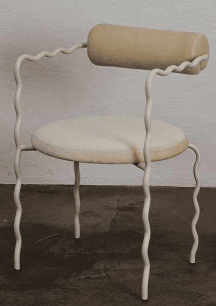 A contemporary chair with a distinctive design. The chair features a tubular, cream-colored frame wi… — 3D model