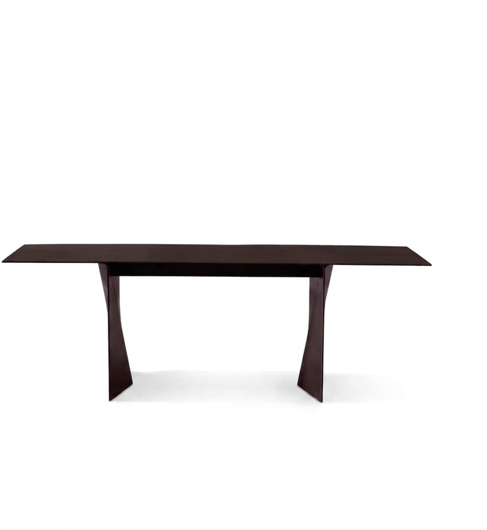 A long, rectangular table featuring a dark, presumably wood or wood veneer, finish. The tabletop is… — 3D model