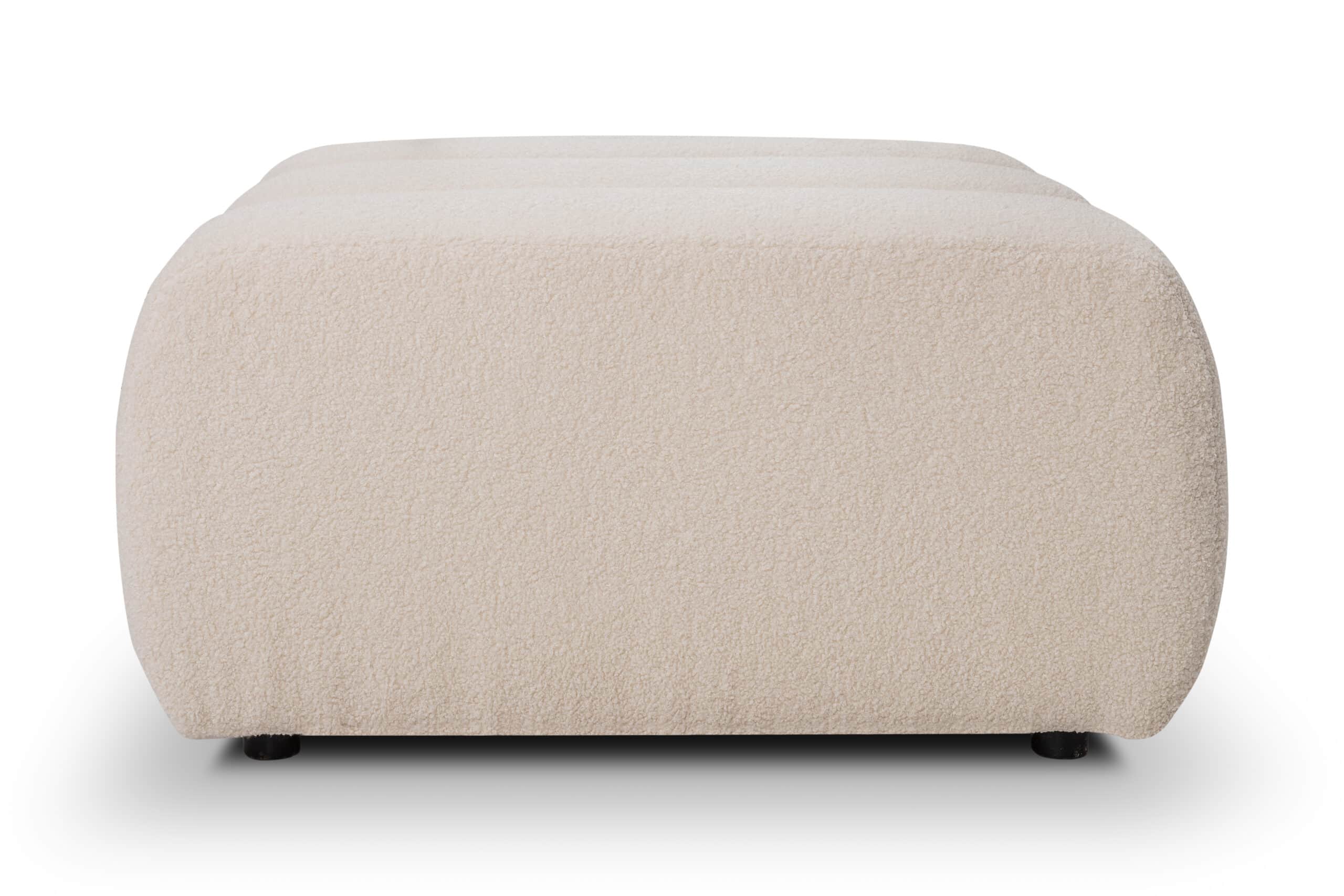 A rectangular ottoman with rounded edges.  The ottoman appears to be upholstered in a thick, plush,… — 3D model