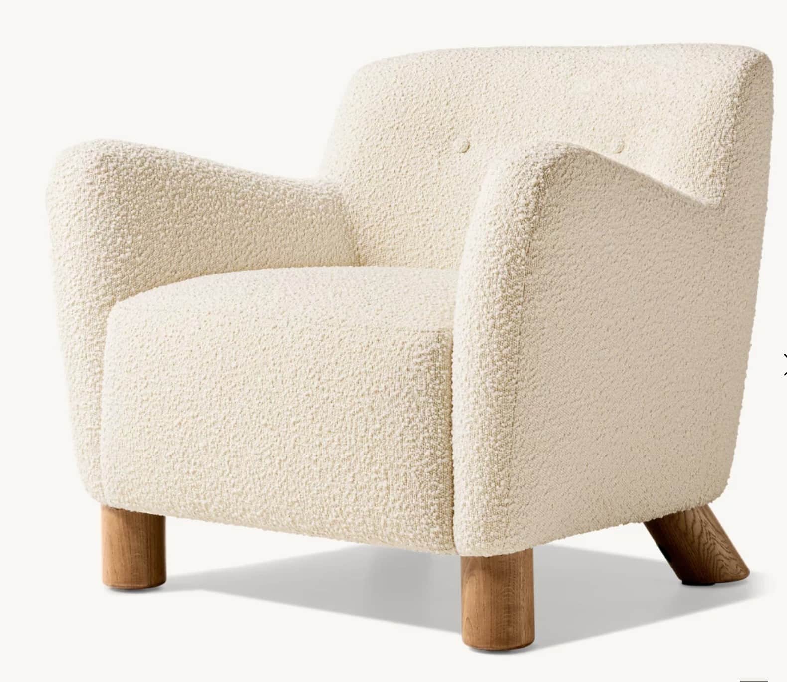 A contemporary armchair upholstered in cream-colored bouclé fabric, featuring a rounded silhouette,… — free OBJ 3D model