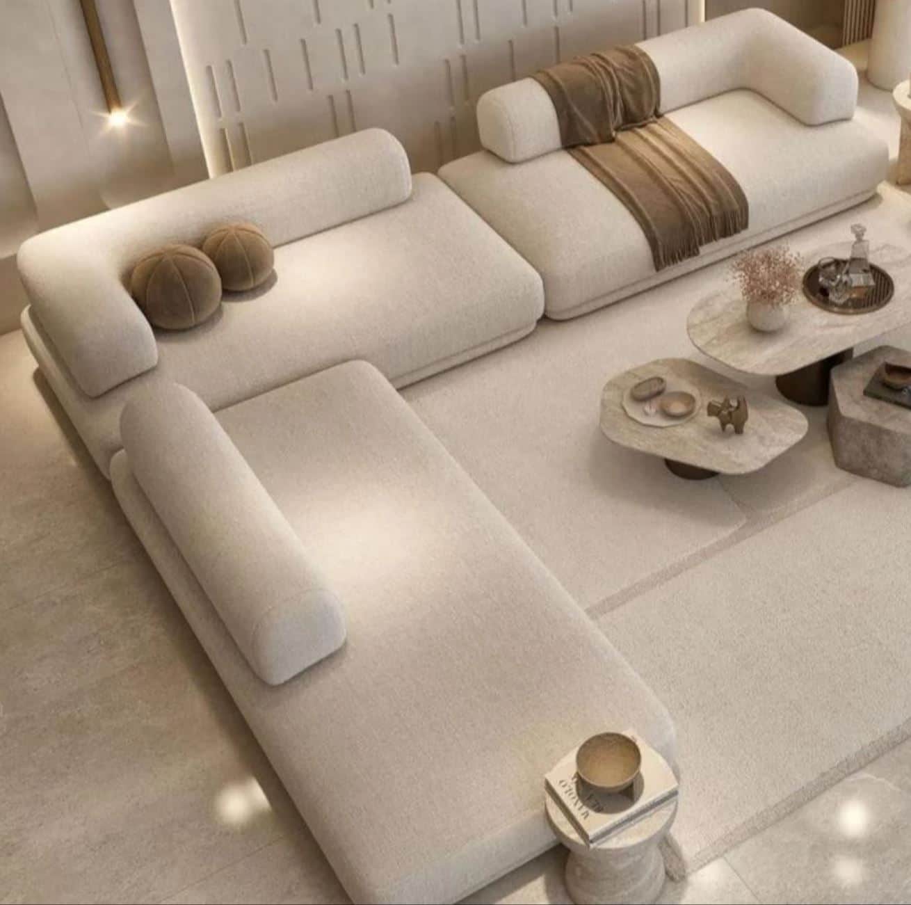 A modular sectional sofa with a low profile and rounded armrests. The sofa is upholstered in a textu… — 3D model