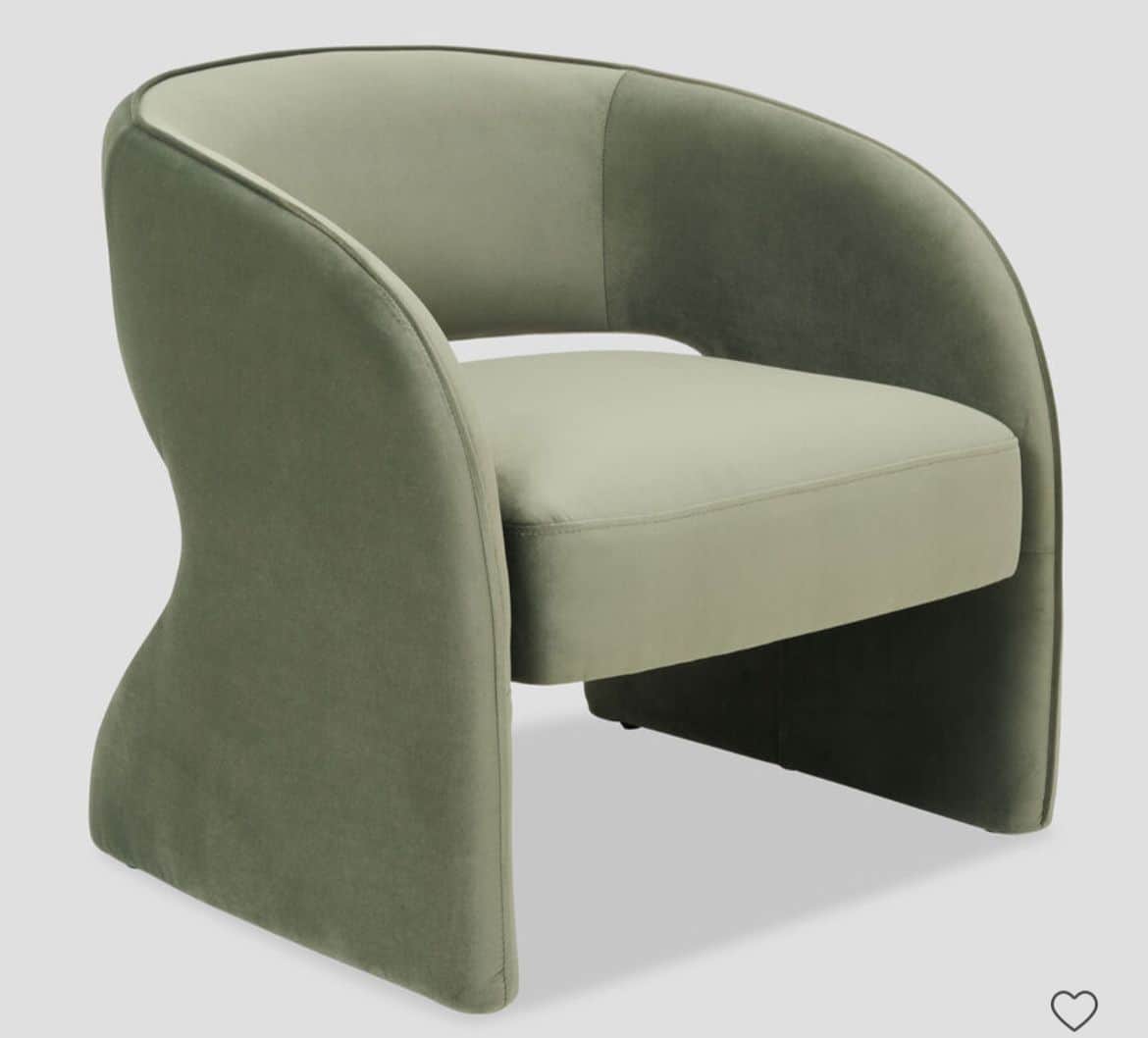 A modern armchair with a curved silhouette and upholstered in a soft fabric. The armchair features a… — 3D model