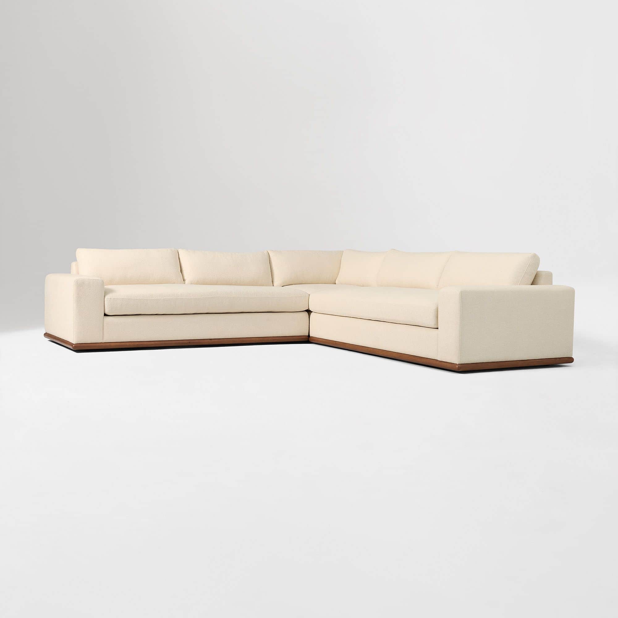 A large, L-shaped sectional sofa with a low profile and clean lines. The sofa features a fabric upho… — 3D model