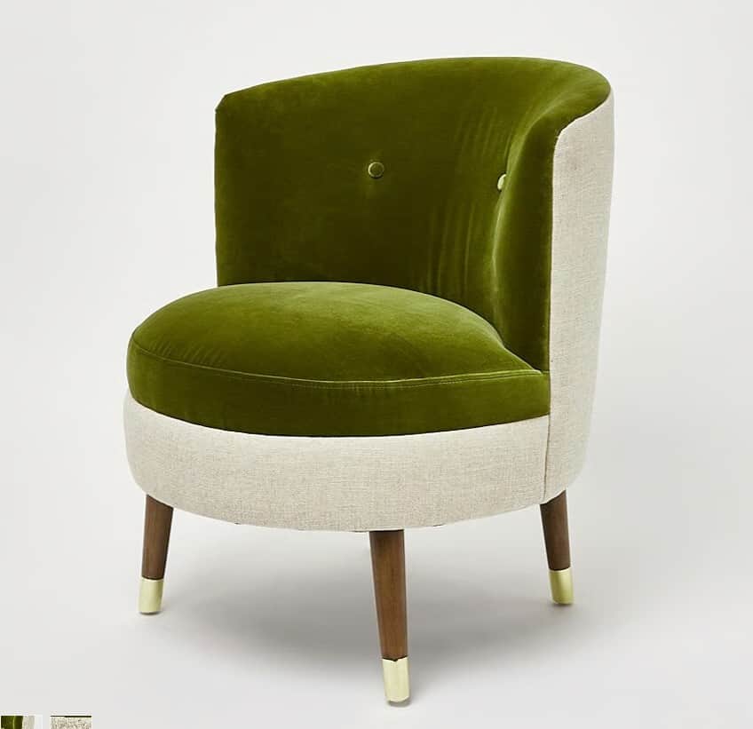 A contemporary armchair with a curved back and seat upholstered in a plush, olive-green velvet fabri… — free GLTF 3D model