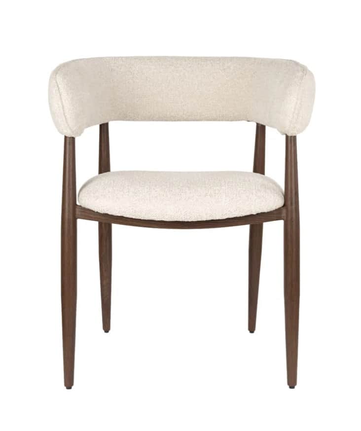 A contemporary dining chair featuring a dark wood frame and light cream-colored boucle upholstery. T… — 3D model