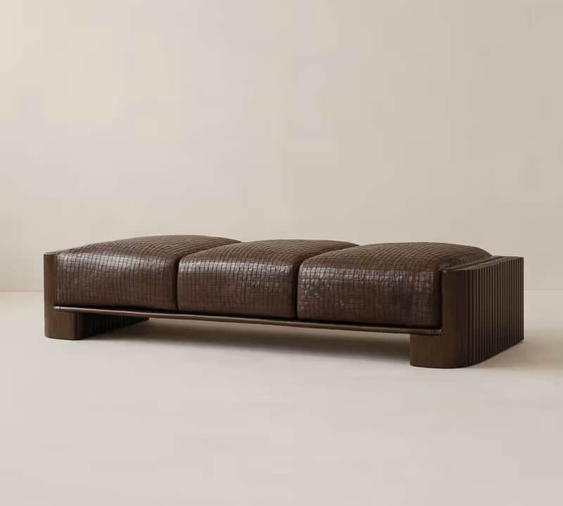 A long, upholstered bench with three distinct seat cushions. The upholstery appears to be a woven le… — free SKP 3D model