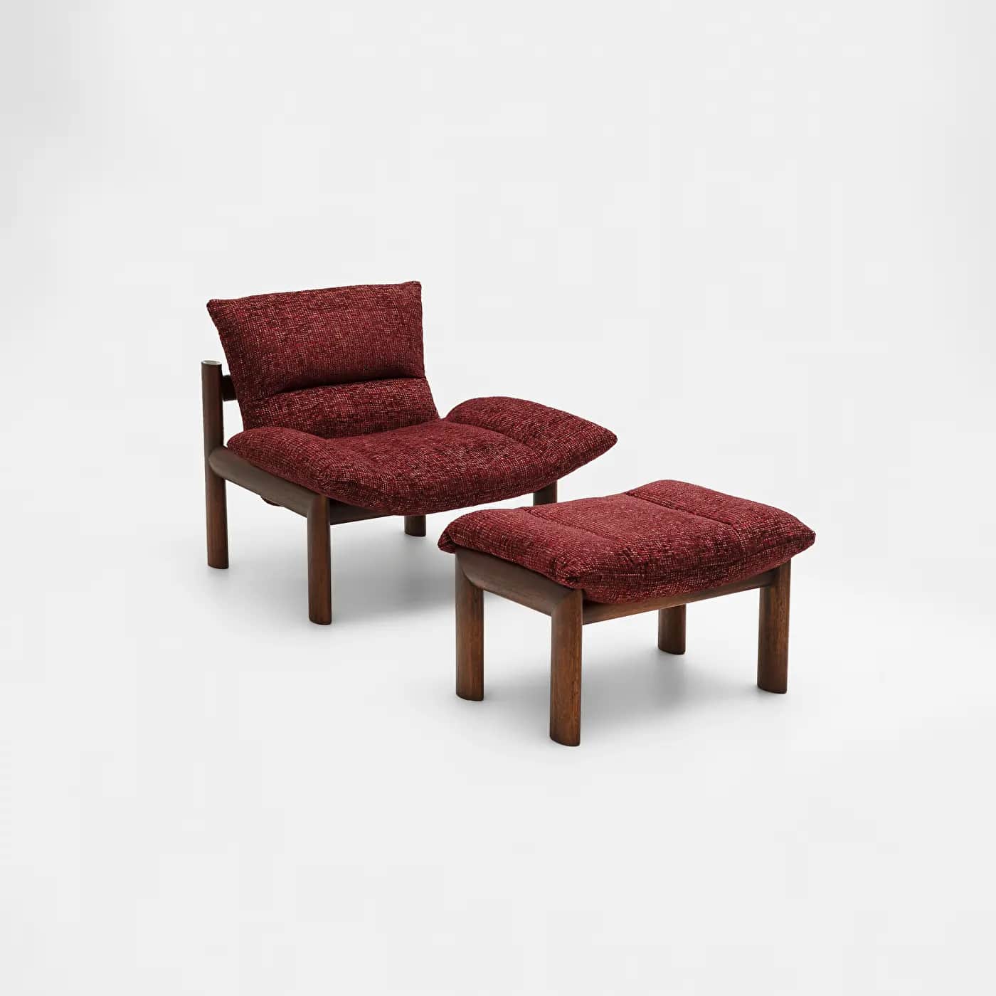 A two-piece seating set consisting of a lounge chair and a matching ottoman. Both feature sturdy dar… — 3D model