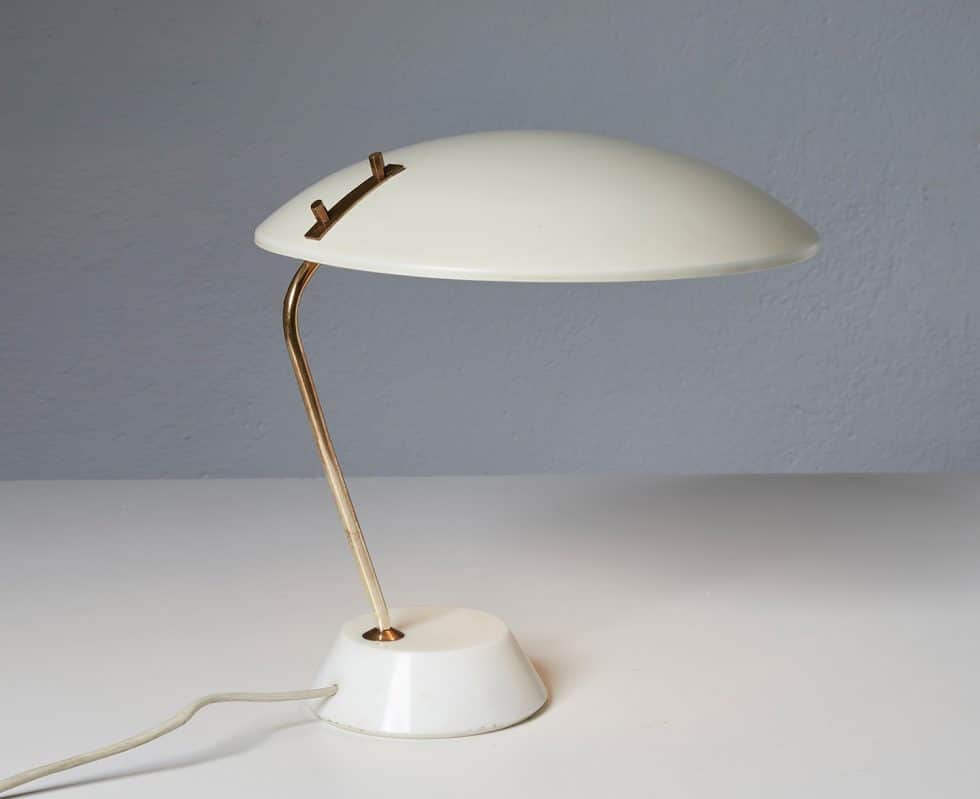 A mid-century modern table lamp with a creamy white, mushroom-shaped shade and a slender, curved bra… — 3D model