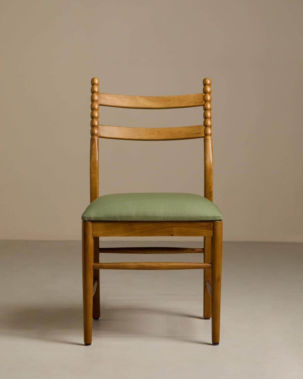 A light-toned wooden dining chair featuring a distinctive bobbin-turned back structure, horizontal c… — 3D model