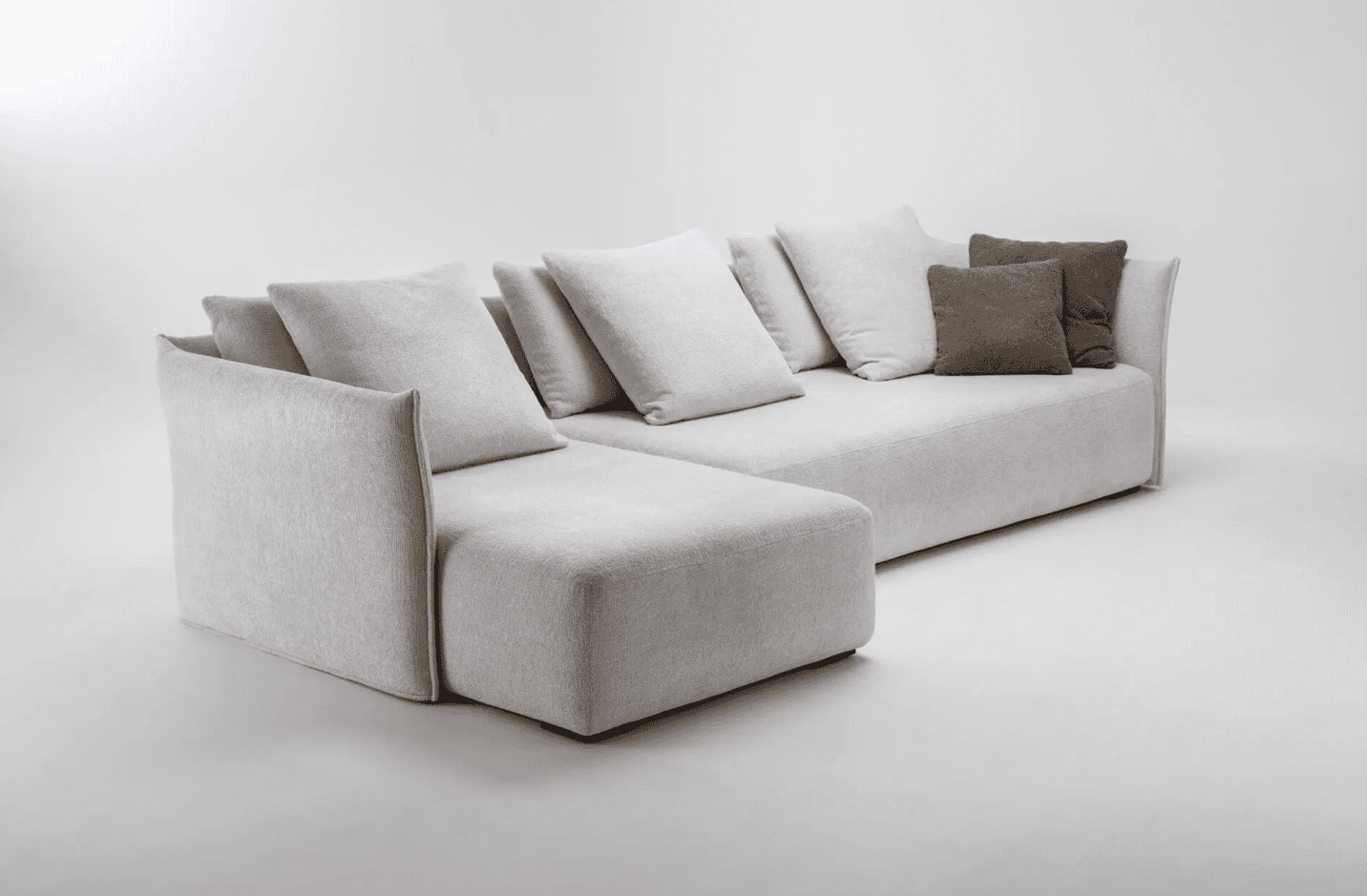 A sectional sofa with a chaise lounge extension. The sofa features deep seating and is upholstered i… — 3D model