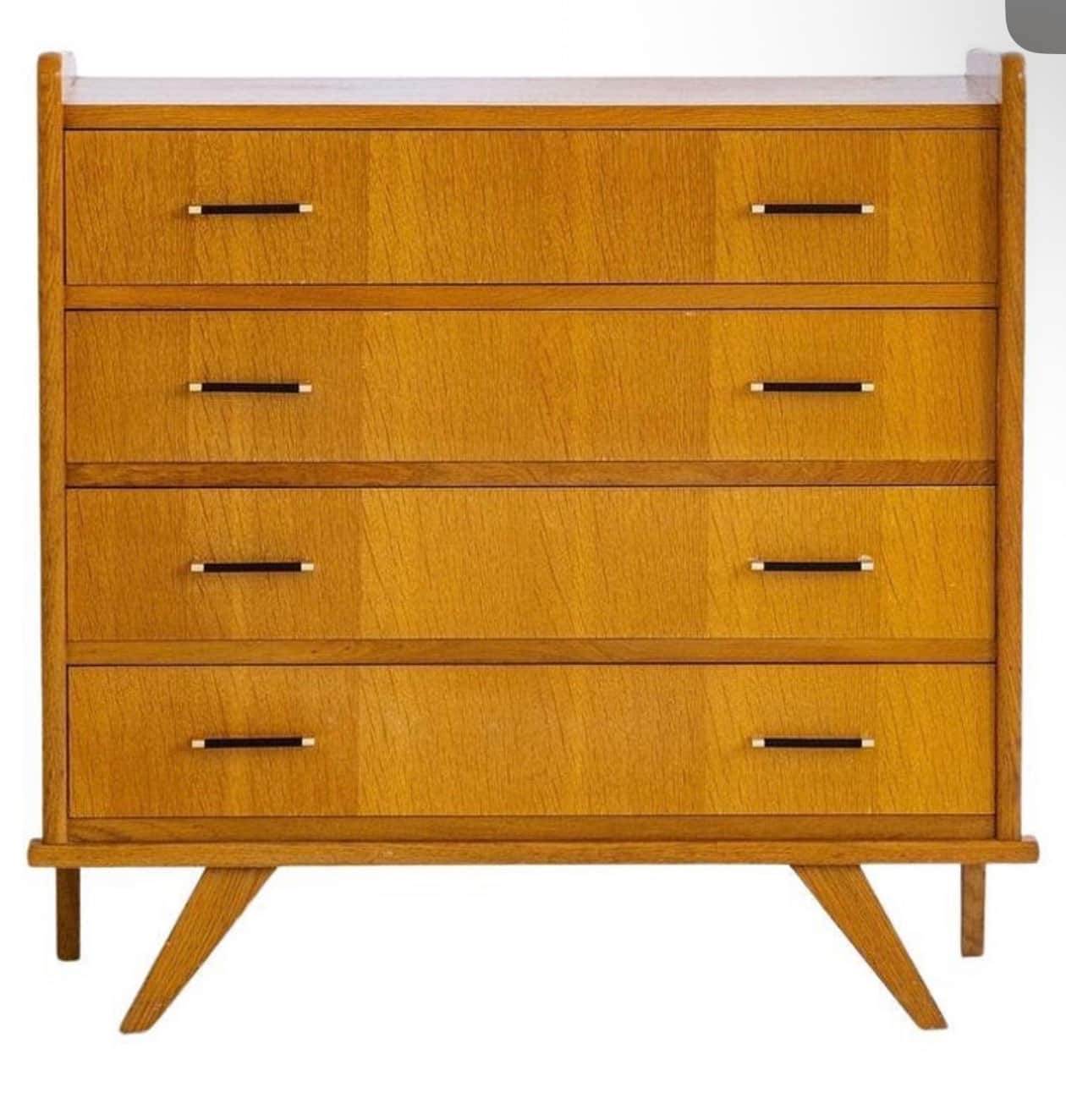A vintage wooden dresser with four drawers. The dresser features a light wood grain finish, horizont… — 3D model