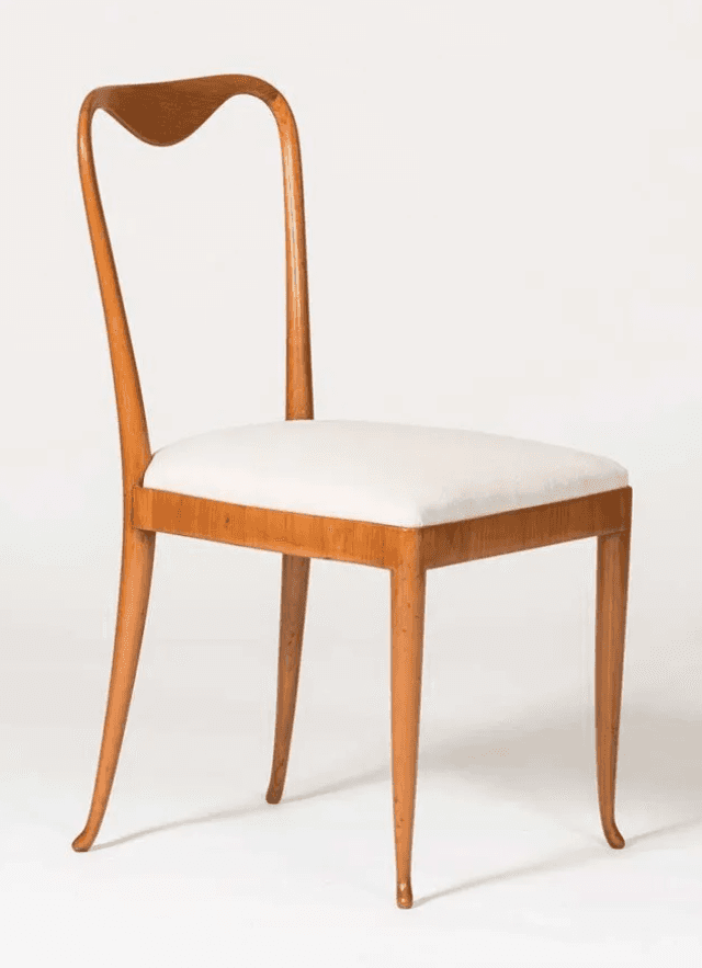 A side chair with a curved wooden frame and a cushioned seat. The backrest has a distinctive heart-s… — 3D model