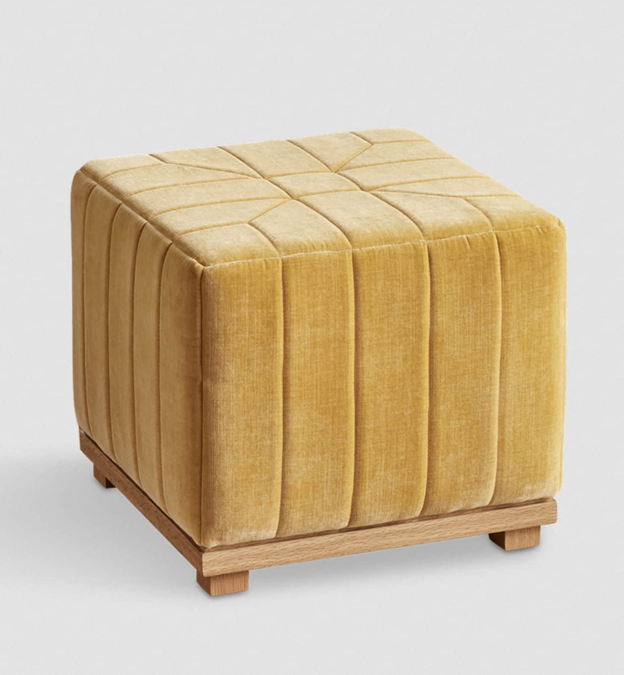 A cubic ottoman upholstered in a textured golden yellow velvet fabric. The upholstery features verti… — 3D model