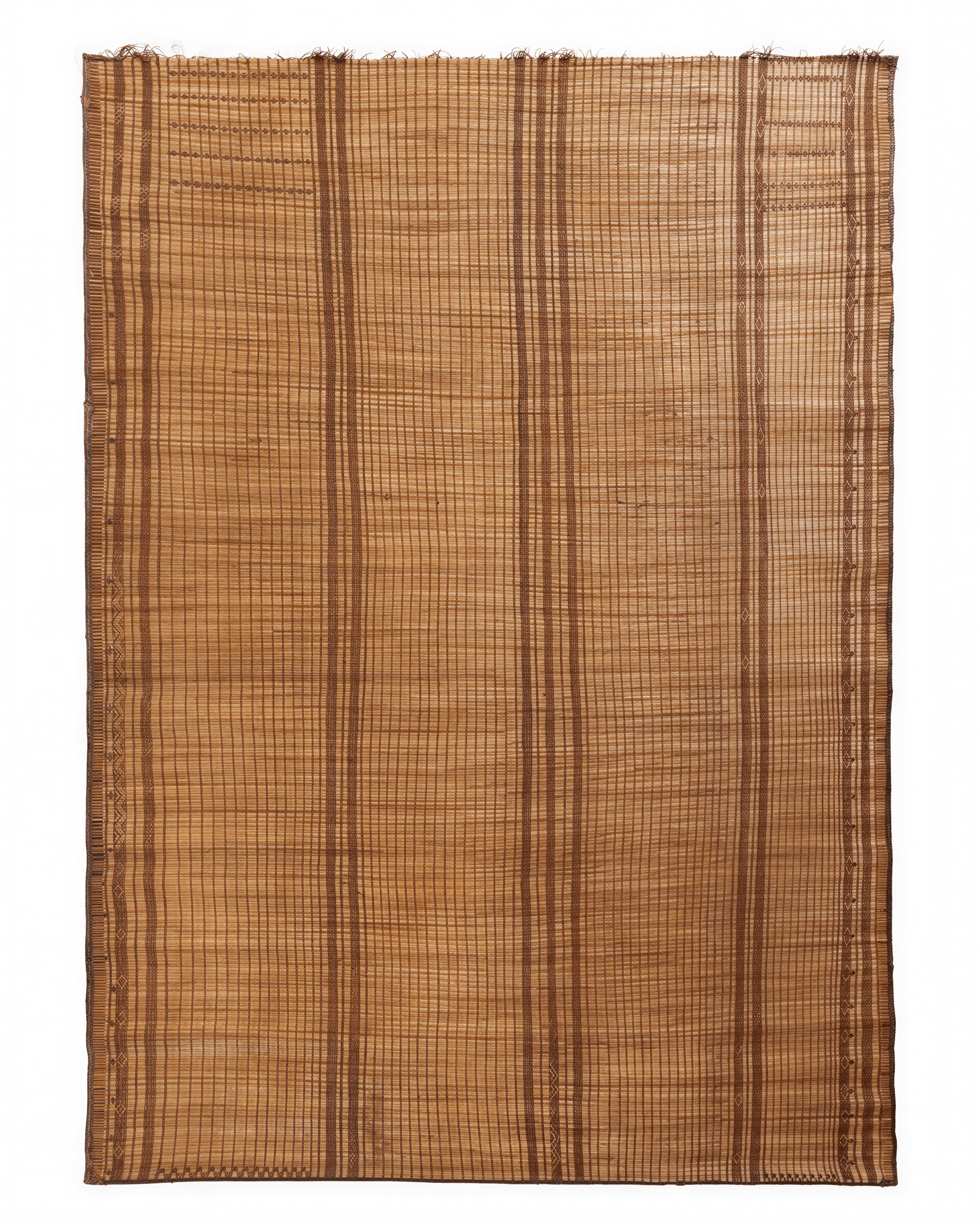 A flat-woven rug constructed from natural fibers, likely bamboo or reeds, interlaced with darker threads. The rug features a dense, grid-like pattern formed by the interlacing fibers. Prominent vertical stripes of a darker hue run the length of the rug, interspersed with decorative bands featuring a diamond-shaped motif. The edges are finished with a fringed trim and a woven border. — 3D model