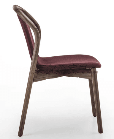 A modern dining chair with a curved wooden frame and a upholstered seat and backrest. The chair features slender, bentwood legs and armrests that merge into the back support. The upholstery is a textured, dark red fabric. — 3D model